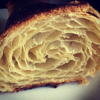 Why are our croissants so good? We use organic grain (about 15% stoneground), a grass-fed butter, and two pre-ferments to achieve a flaky exterior and a tender tear-apart interior.  Ingredients: Wheat flour*, butter*, whey* and/or water, stoneground wheat flour*, sugar*, eggs*, sea salt, yeast, sourdough culture*  *Organic or sustainably produced  Contains wheat, milk, egg